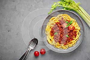 Pasta Spaghetti Bolognese in gray bowl on concrete background. Bolognese sauce is classic italian cuisine dish