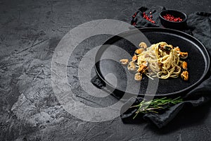 Pasta Spaghetti with mussels, tomato sauce on black background. sea food meal. space for text