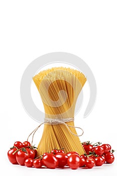 Pasta spaghetti on a white background with fresh tomatoes photo