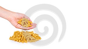 Pasta spiral in hand isolated on white background. copy space, template