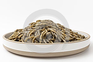 Pasta with squid ink sauce on a white background