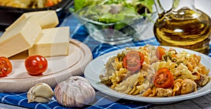 Pasta with tomato, basil leaf, garlic and parmesan