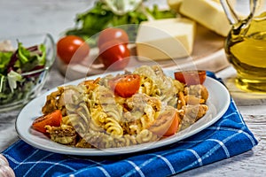 Pasta with tomato, basil leaf, garlic and parmesan