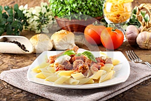 Pasta with tomato, sausage and ricotta