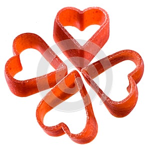 Pasta. uncooked red heart on white background