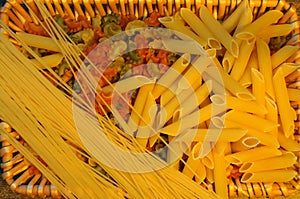 Pasta variation in a brown basket .