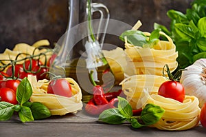 Pasta, vegetables, herbs and spices for Italian food on the wooden background