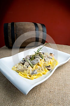 Pasta with white sauce and mushrooms photo