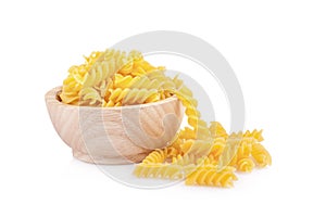 Pasta in wooden bowl, isolated on white background