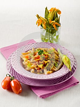 Pasta with zucchinis flower photo