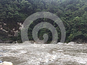 The Pastaza river, a large ropical river running along two high cliffs