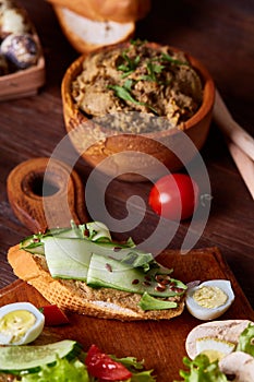 Paste from chicken liver with vegetable sandwiches , shallow depth of field, close-up, vertical.