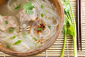 Paste of rice flour with pork in wooden bowl