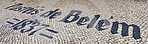 Pasteis de Belem sign inlaid in mosaics photo