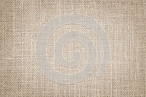 Pastel abstract Hessian or sackcloth fabric texture background.