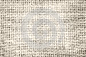 Pastel abstract Hessian or sackcloth fabric texture background.