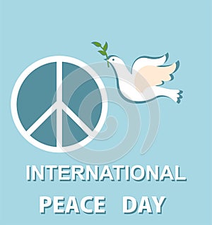 Pastel blue greeting card with paper cut out dove and peace symbol for International Peace day