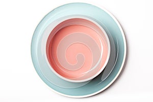 Pastel blue plate and pink bowl on white background