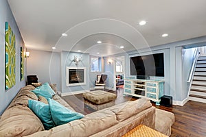 Pastel blue walls in basement living room interior.