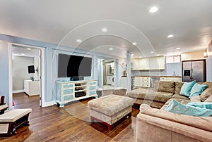 Pastel blue walls in basement living room interior.