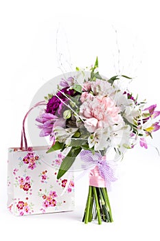 Pastel bouquet from pink and purple gillyflowers on white with g