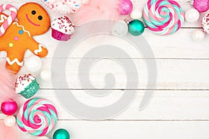 Pastel Christmas sweets decor, corner border over white wood