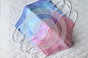 Pastel color cloth mask Place on white paper