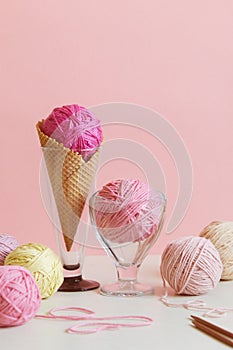 Pastel colored ball of yarn in a dessert bowl and in a waffle cone