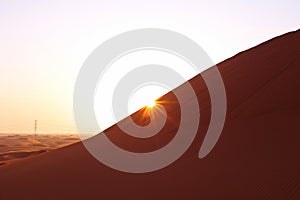 Pastel colored desert sunrise in the sand dunes of Arabian desert, Riyadh, Saudi Arabia.