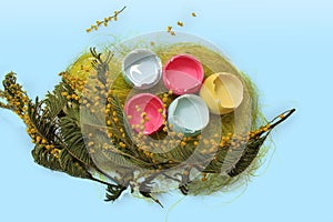 Pastel colored easter eggs on blue background