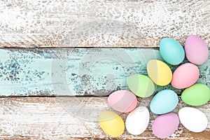 Pastel colored easter eggs decoration wooden background