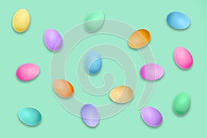 Pastel colored Easter eggs on green, Easter pattern