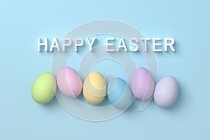 Pastel colored eggs on blue background with happy easter greeting message
