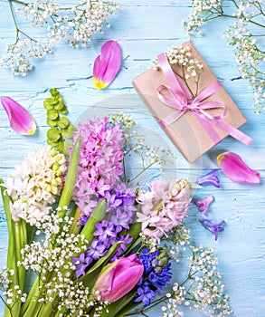 Pastel colored flower and a gift box