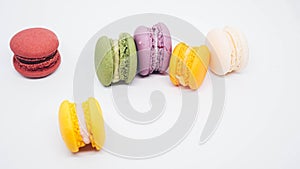 Pastel colored macarons isolated on white background