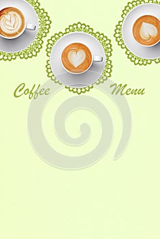 Pastel colors coffee menu with three white porcelain cappuccino cups on green napkins in vintage style. Hearts latte art.