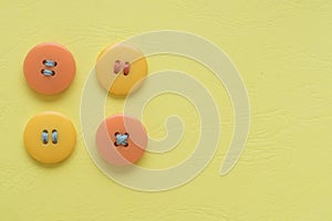 Pastel colors. Yellow and orange buttons