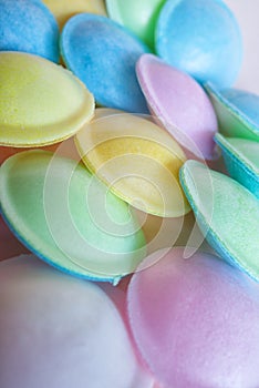 Pastel coloured and sherbert filled flying saucer sweets. Close up. Background. photo
