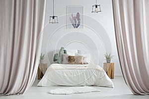 Pastel curtains in rustic bedroom photo