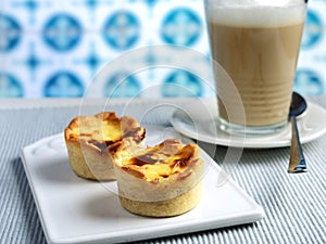 Pastel de nata and coffee latte photo
