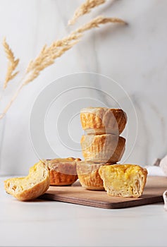 Pastel de Nata - portugese egg custard pies. Portuguese pastie lying on top of each other photo