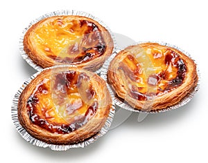 Pastel de nata tarts in foil cups on white background. File contains clipping path photo