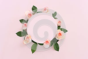 Pastel delicate background with pink roses and petals. Top view