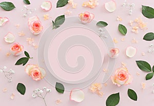 Pastel delicate background with pink roses and petals. Top view