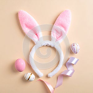 Pastel Easter Eggs and Bunny Ears Headband on Beige Background in Studio