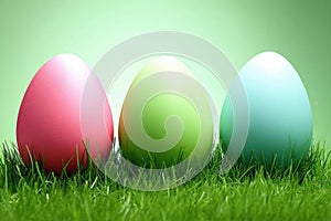 Pastel Easter eggs in grass