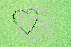 Pastel green heart in clean sparkling background