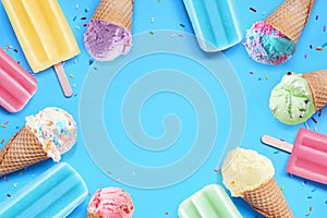 Pastel ice cream cones and popsicle frame on a blue background
