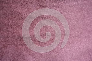 Pastel pink artificial suede fabric from above