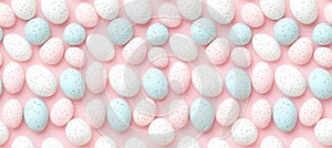 Pastel pink and blue speckled easter eggs on light pink background